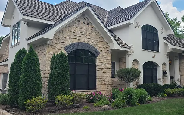 Pete Klasek working on a stucco repair exterior house project